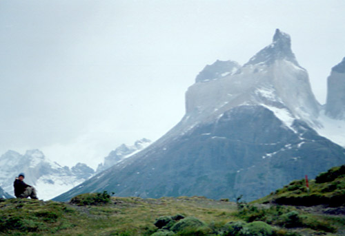 Robyn, solitary, beneath the Cuernos del Paine. This is the classic spot for Robyn.